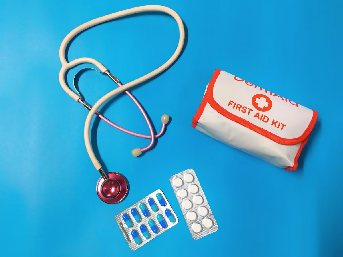 How many first aiders a workplace needs, shown by a workplace first aid kit and supplies
